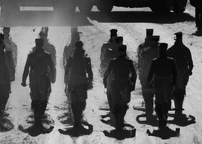 1. DALL·E 2023-03-10 23.25.24 - soldiers marching on a dusty road. black and white background(1)