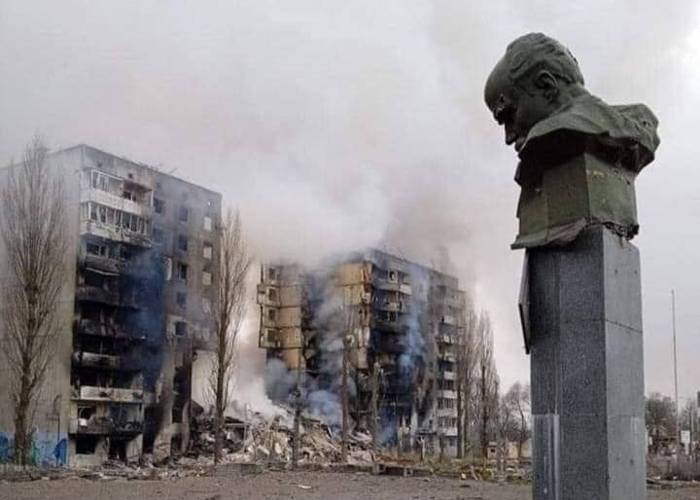 1. photo of destroyed building with a statue in front. Ukraine