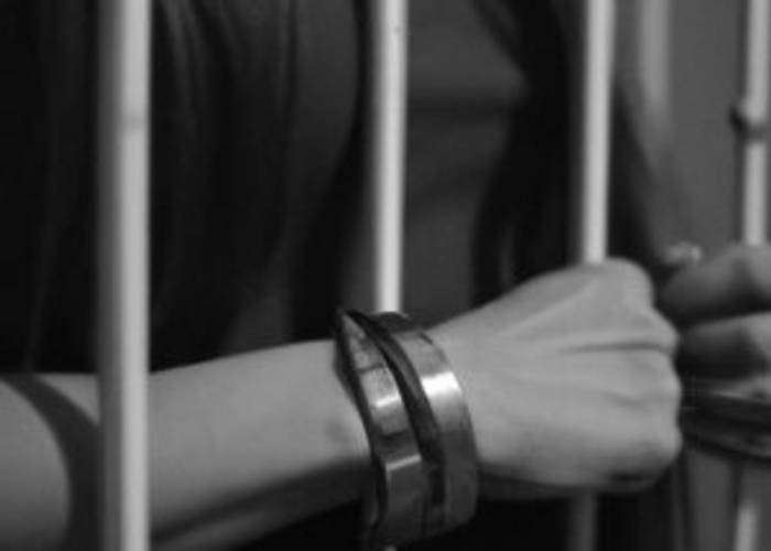 handcuffed-hands-and-the-bars4